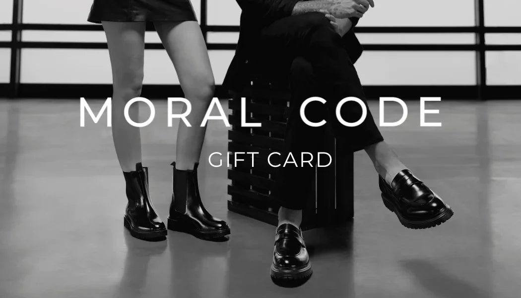 Two people sitting on a bench with 'Moral Code' gift card text overlay