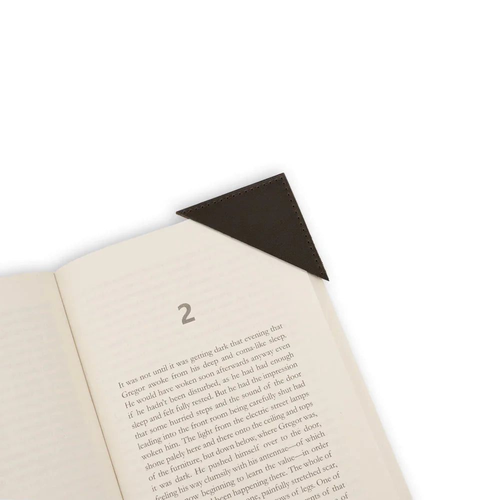 Open book with a black corner bookmark on a white background