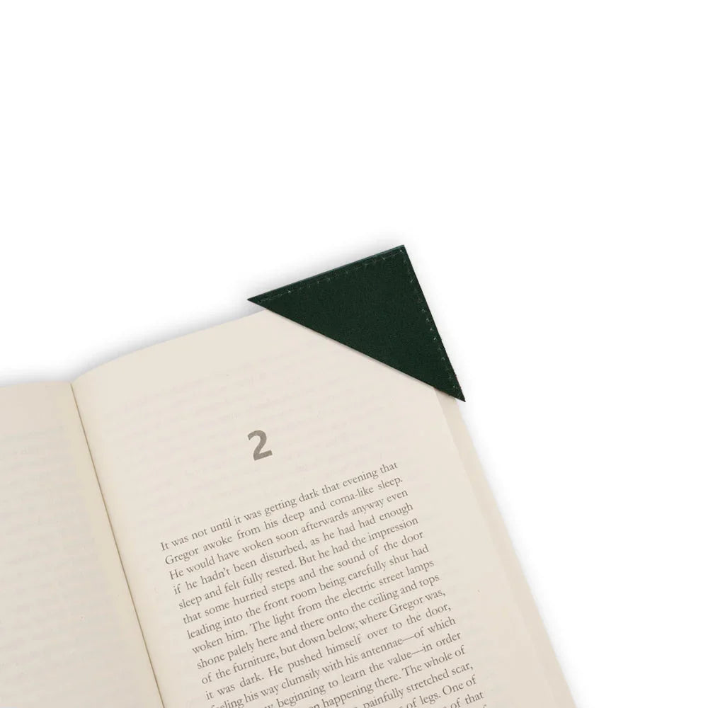 Open book with a green corner bookmark on a white background