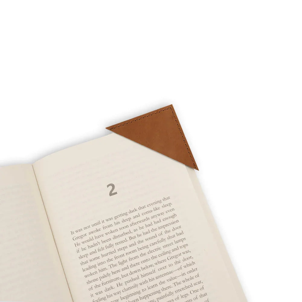 Open book with a brown leather corner bookmark