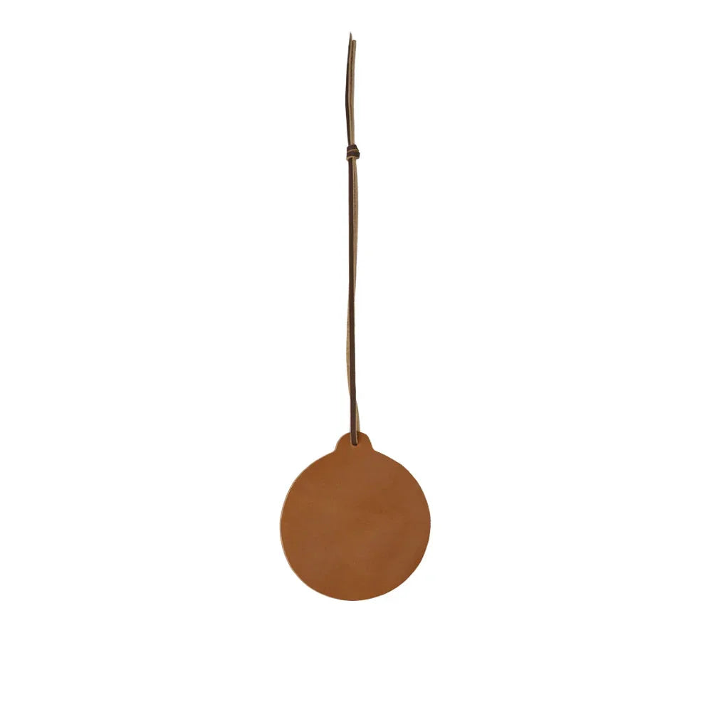Brown leather tag with a string on a white background
