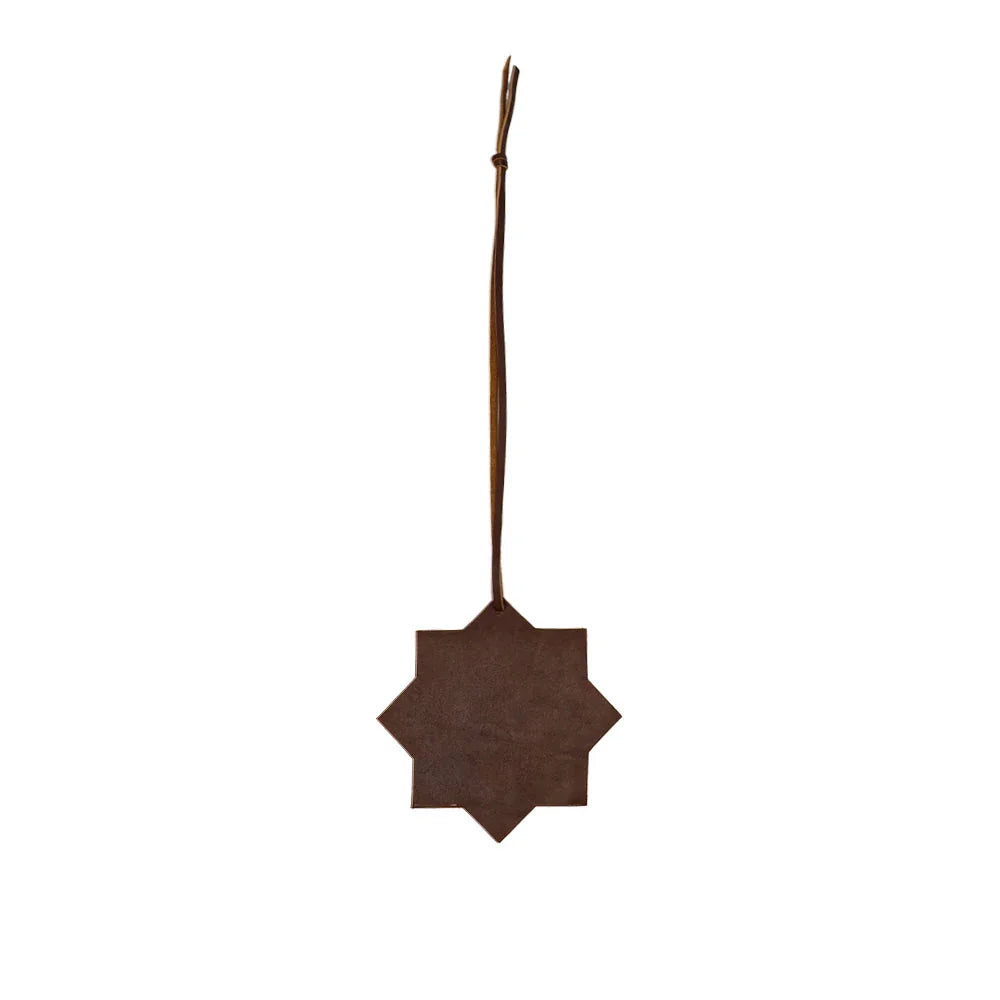 Decorative brown star-shaped ornament on a white background