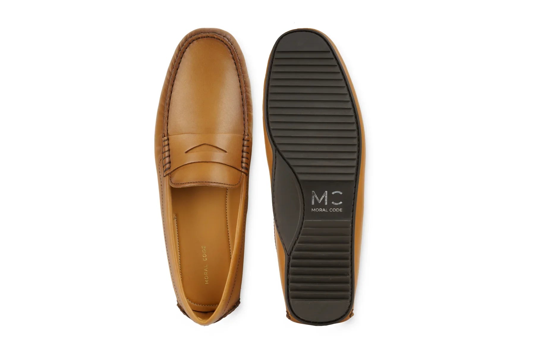 Tan leather penny loafers with stitched detailing and black rubber sole, men's dress shoe