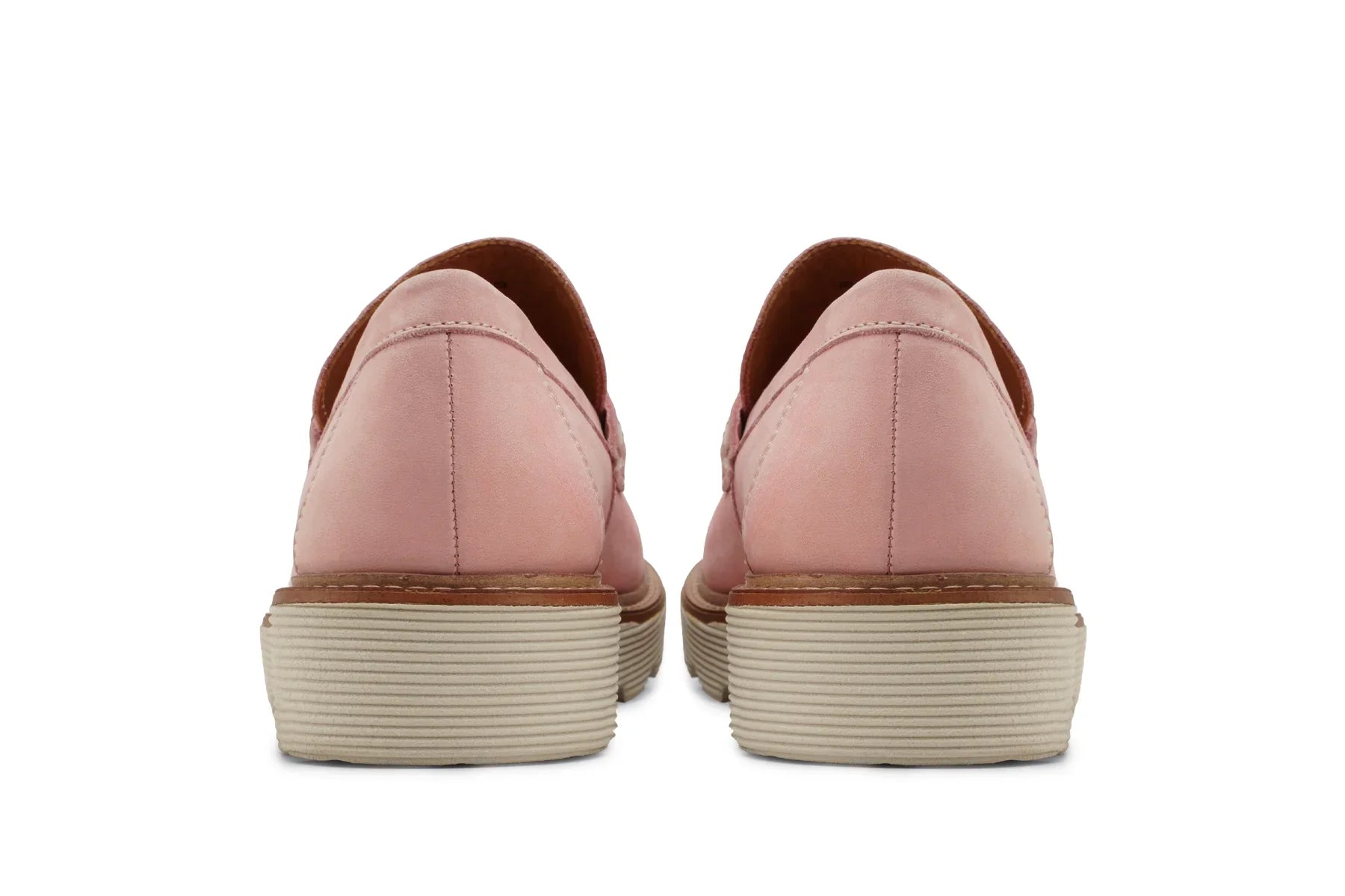 Back view of pink leather loafers with beige ribbed soles on white background