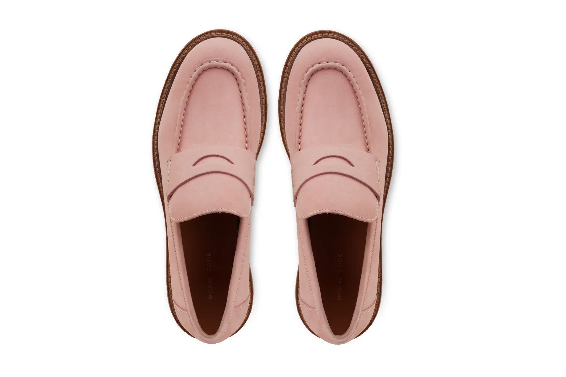 Pair of pink leather men's loafers with brown soles, displayed top-down on a white background