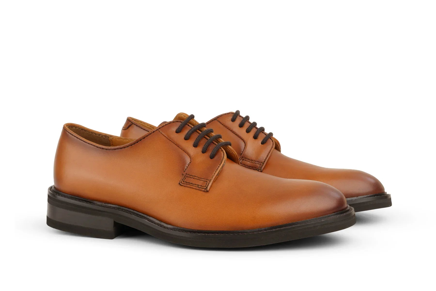 Men's cognac brown leather derby shoes with black laces and dark soles, side view