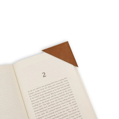 Open book with a brown leather corner bookmark