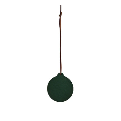 Green round object with a string on a white background