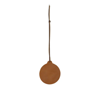 Brown leather tag with a string on a white background