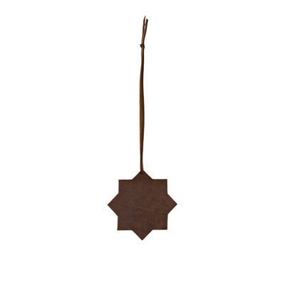 Decorative brown star-shaped ornament on a white background
