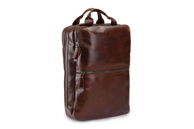 Brown leather backpack on a white background